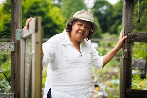 Jamaica Kincaid stands at the entrance to her garden in North Bennington, Vermont.