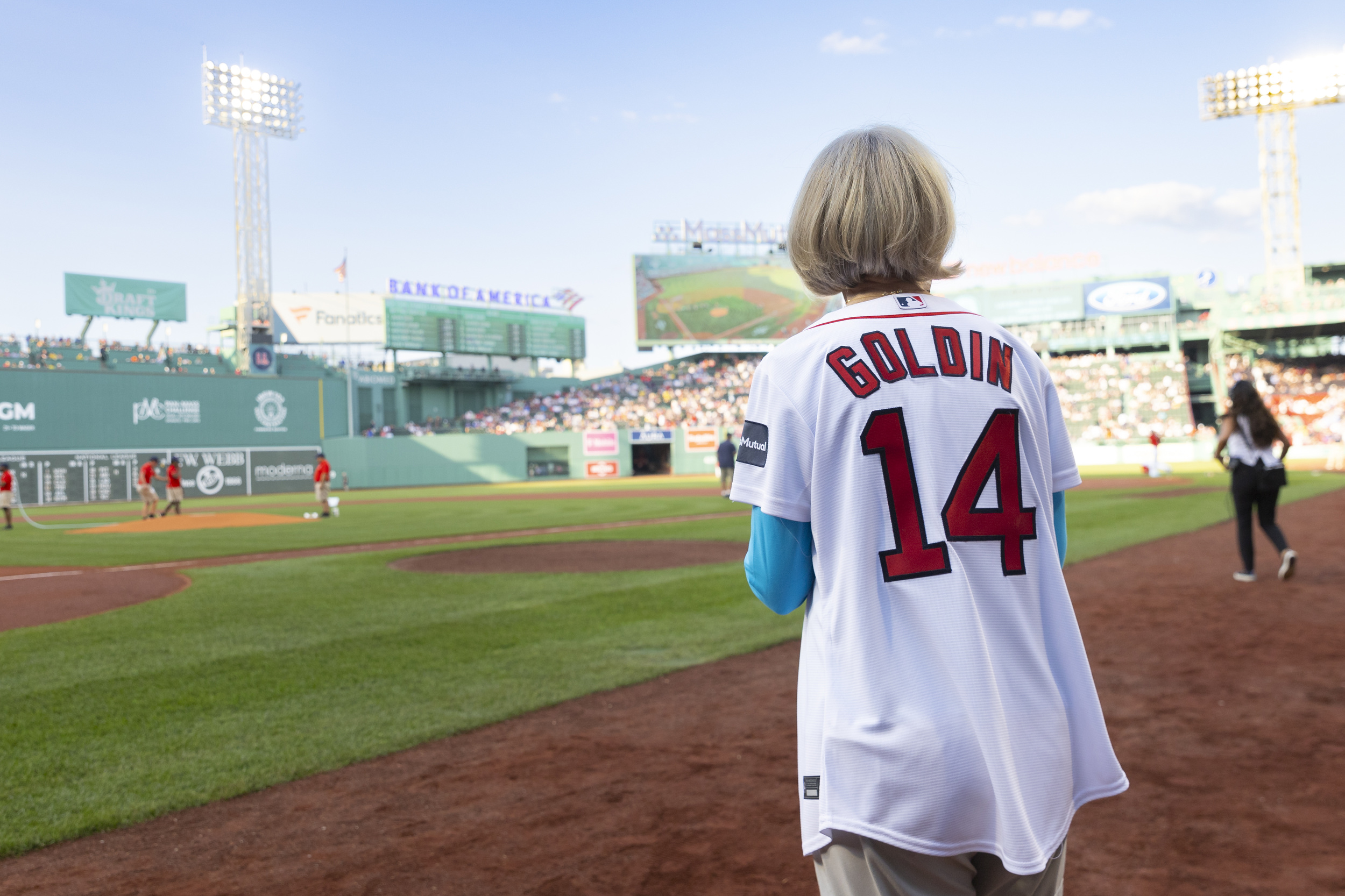 Claudia Goldin before throwing the first pitch at Fenway Park.