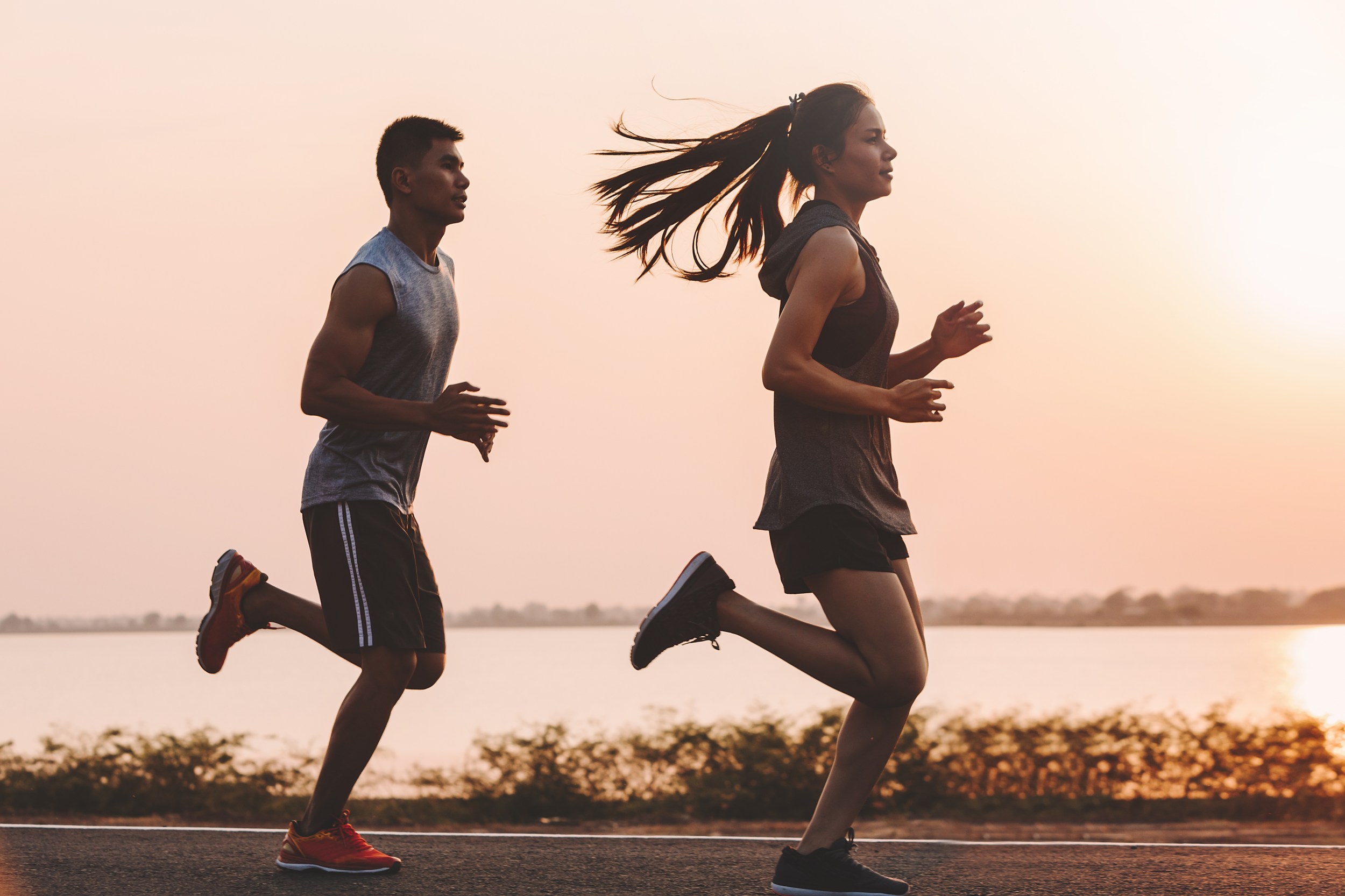 A man and woman running. 