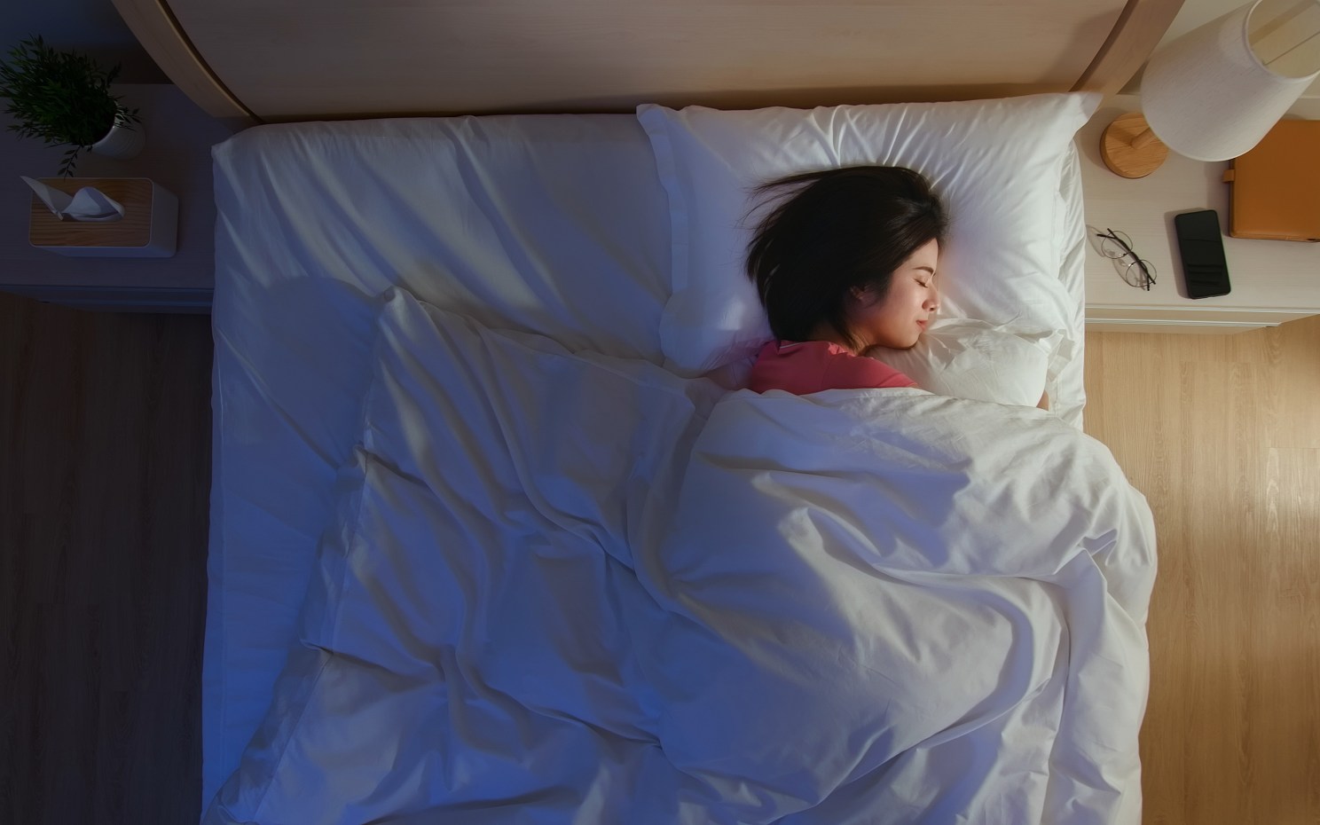 Woman sleeping in bed.