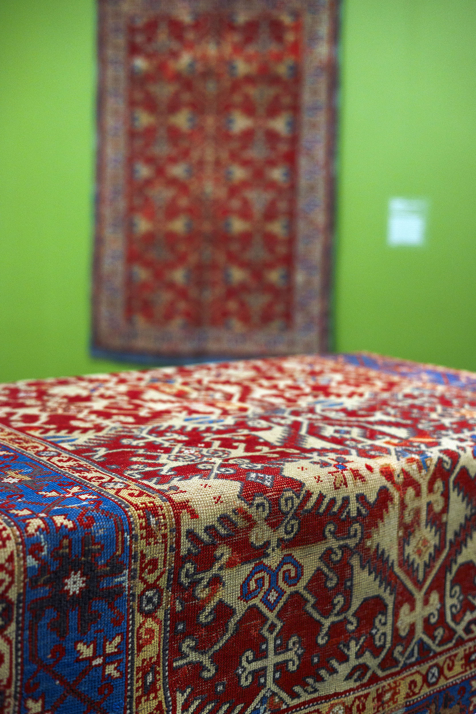 Carpet draped over a Dutch style table.