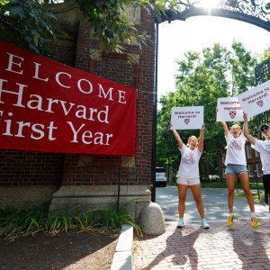 Seniors Katrina Geiersbach (from left), Cecilia Nakfoor, and Nico Vasquez welcome the first-years at Johnston Gate.