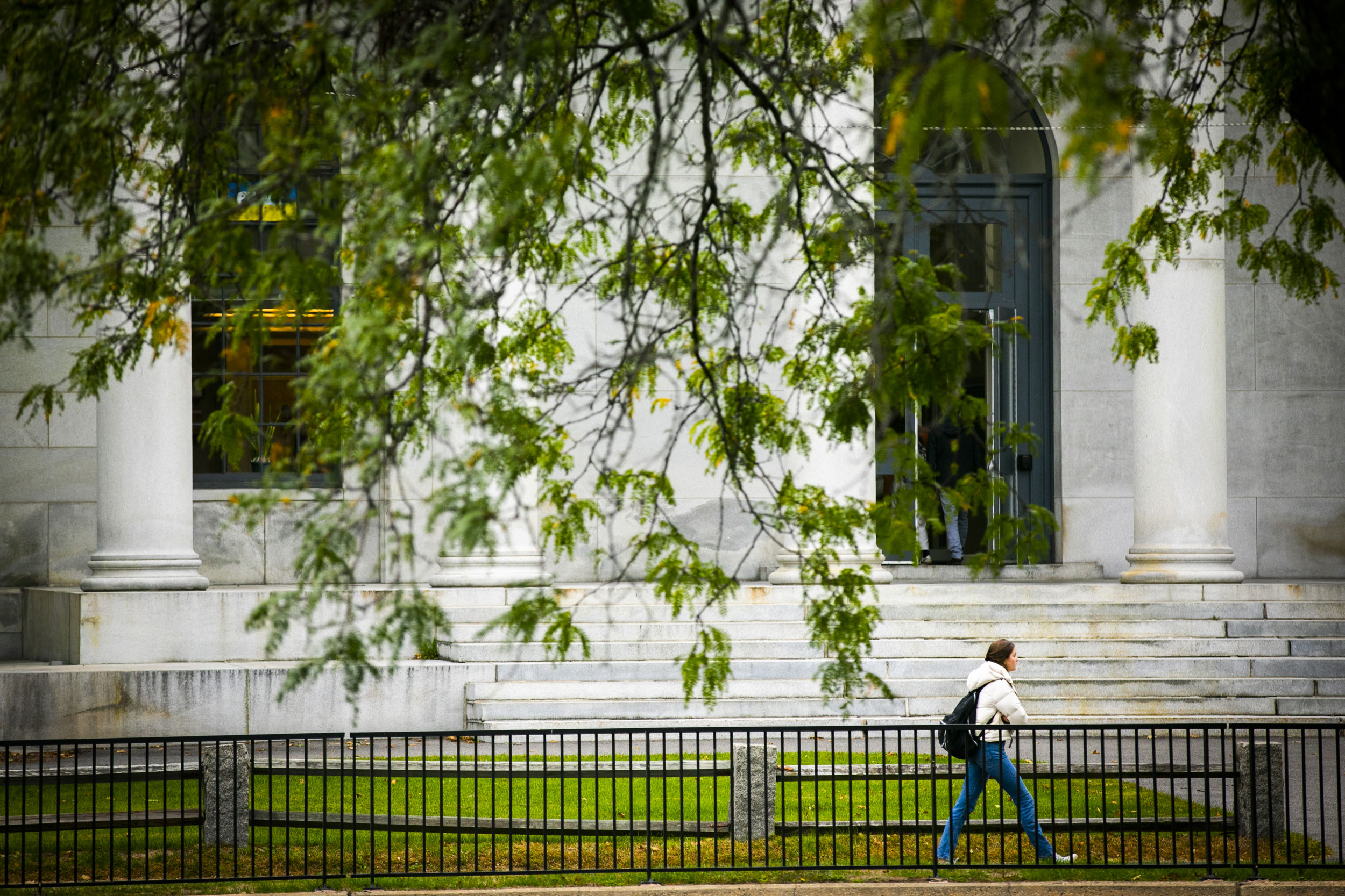 A person walks past Littauer Building.