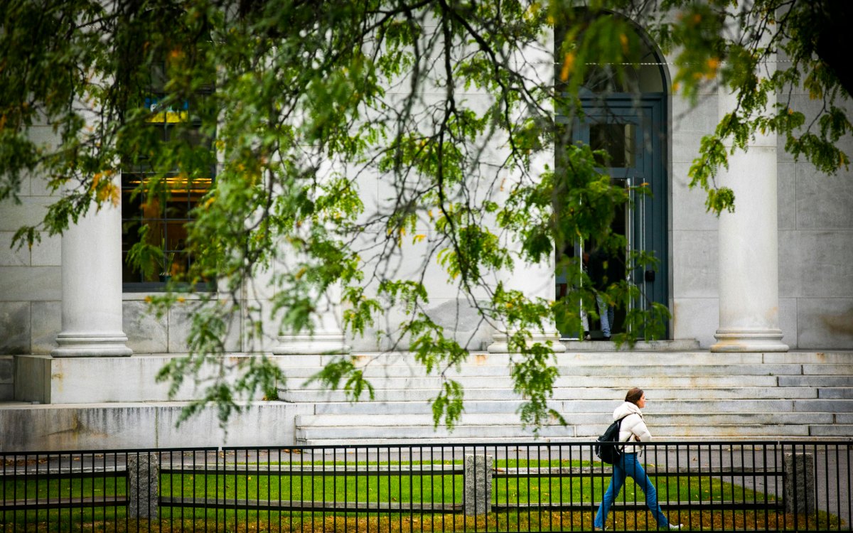 A person walks past Littauer Building.