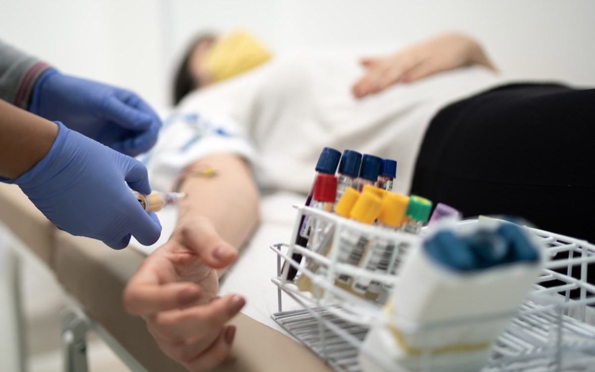 Nurse preparing patient to drawing blood sample.