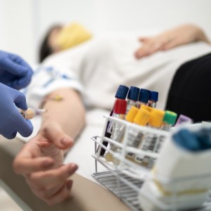 Nurse preparing patient to drawing blood sample.