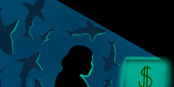 woman on computer surrounded by sharks