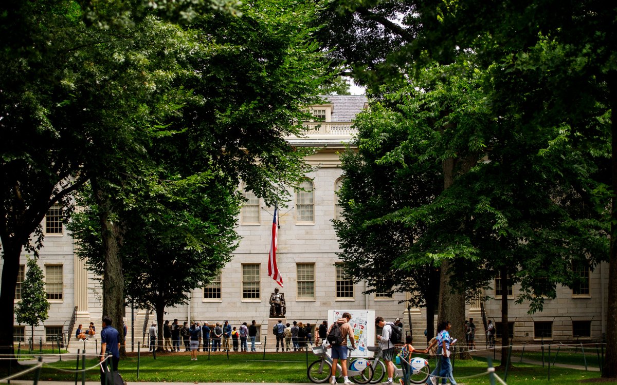 John Harvard Statue in Harvard Yard draws a cloud.