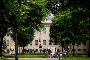 John Harvard Statue in Harvard Yard draws a cloud.