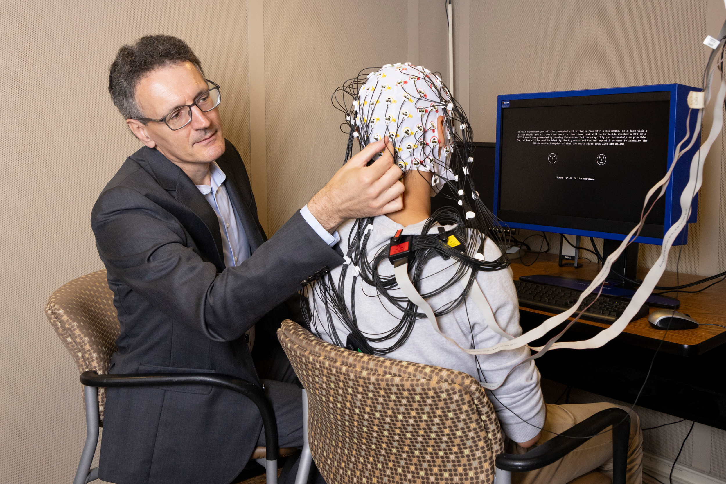 Diego Pizzagalli prepares a research participant for an EEG at McLean Hospital.