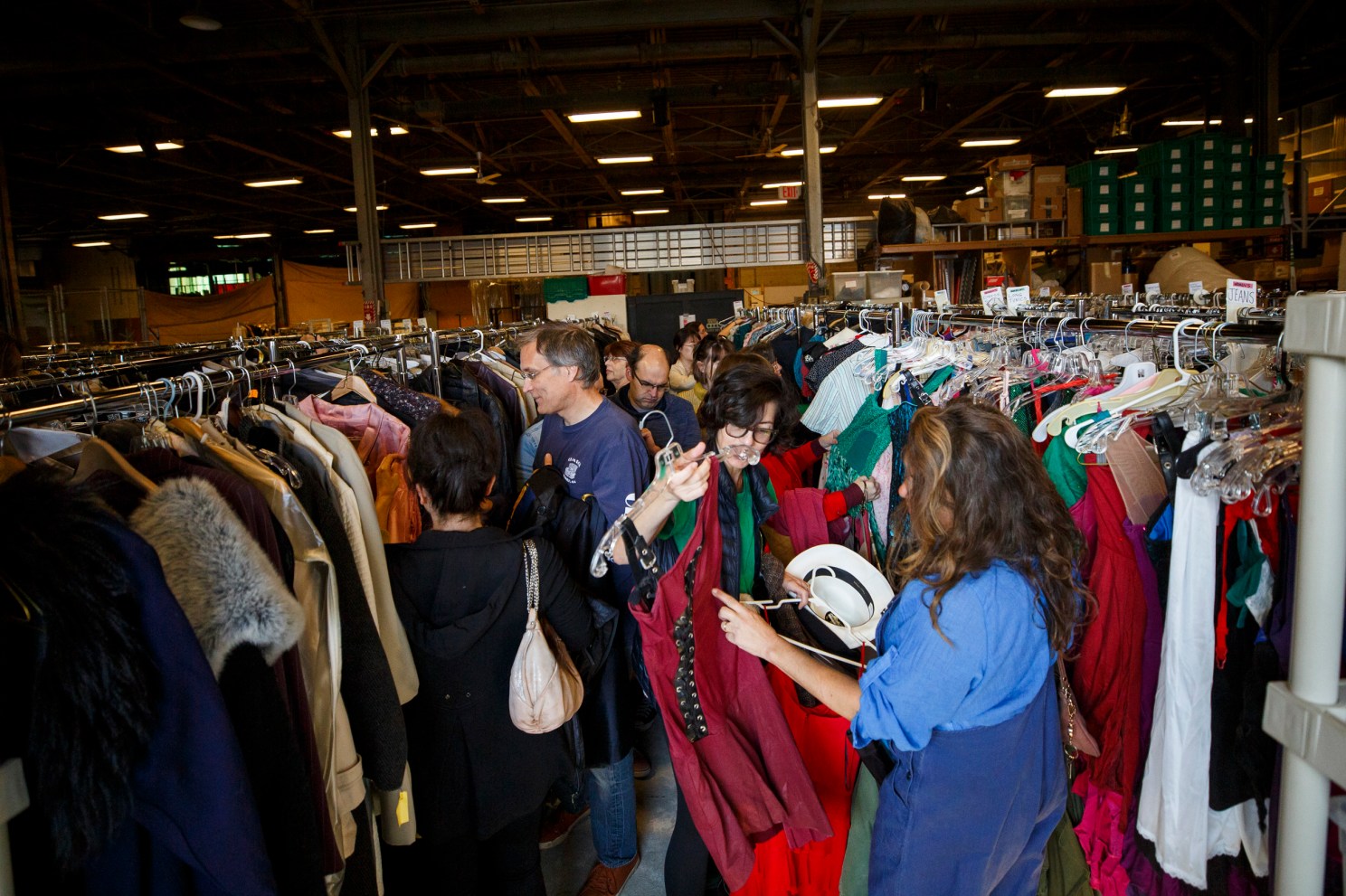 shoppers looking at clothes. 