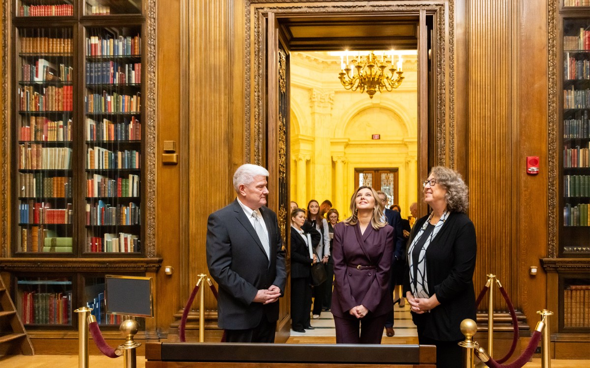 Olena Zelenska (center) takes in the Widener Memorial Room with curator Peter X. Accardo and University Librarian Martha Whitehead.