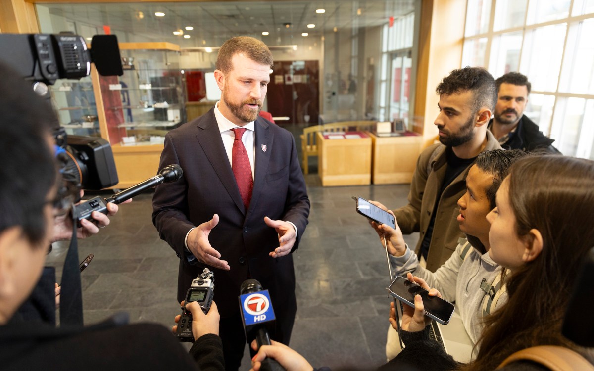 Andrew Aurich (pictured) answers questions from the media. Photos