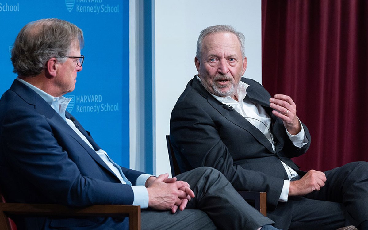 Journalist John Ellis and Lawrence Summers.