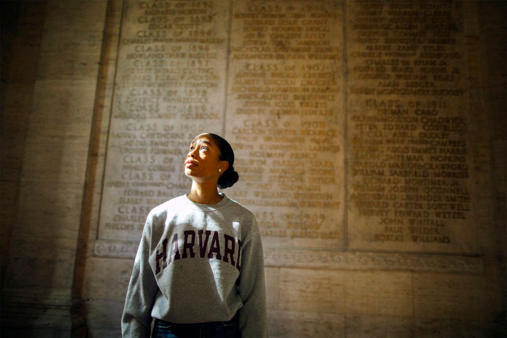 Alexandria Durrant '28 iin the Memorial Room of Memorial Church that honors Harvard veterans.