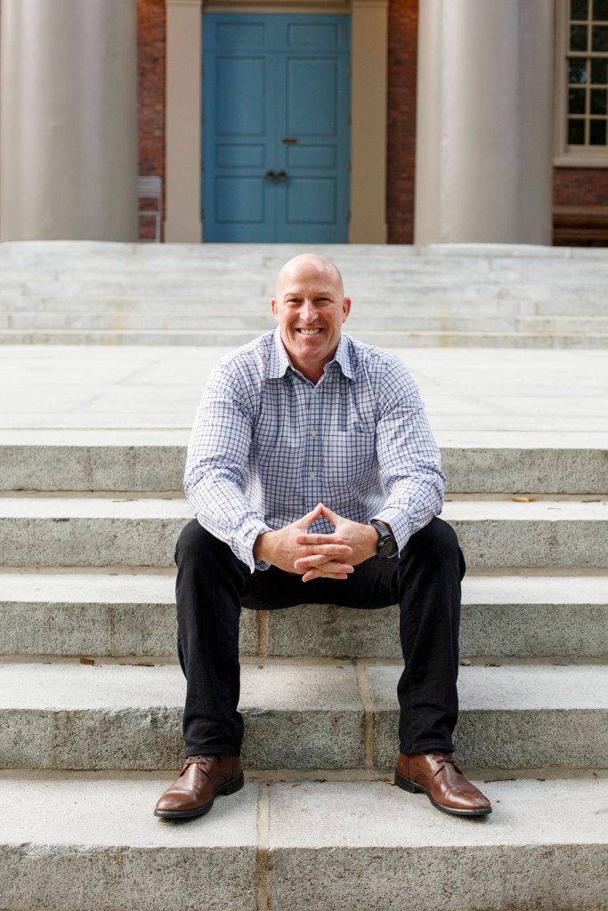 Ed Somuk ’27 (pictured) sits on the steps of Memorial Church.