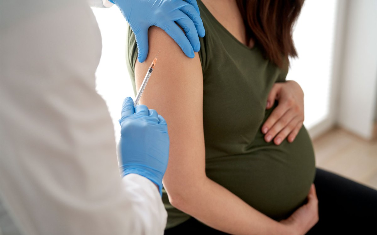 Pregnant woman getting a RSV vaccine.