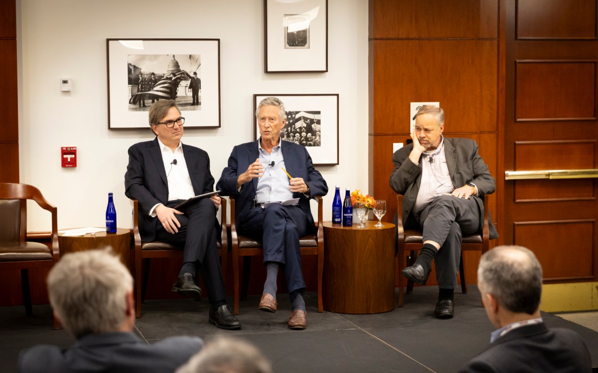 Jason Furman (from left), Olivier Blanchard, and Brad DeLong speaking during the event.