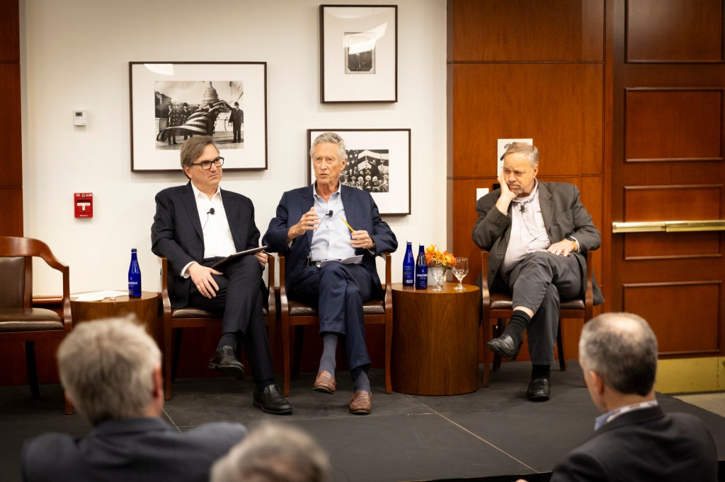 Jason Furman (from left), Olivier Blanchard, and Brad DeLong speaking during the event.