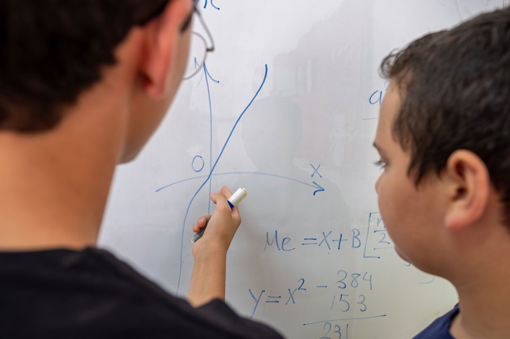 Two students working on a math problem.