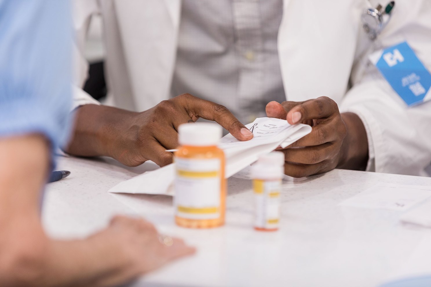 Pharmacist talking to a patient about prescription.