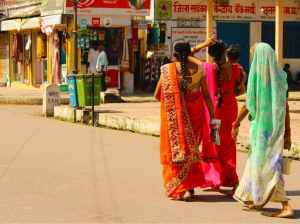 Three women walking together in Rajasthan, India.