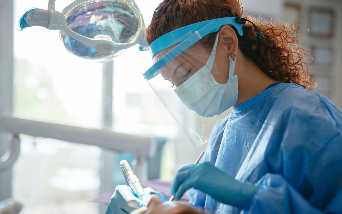 Dentist examining patient's teeth.