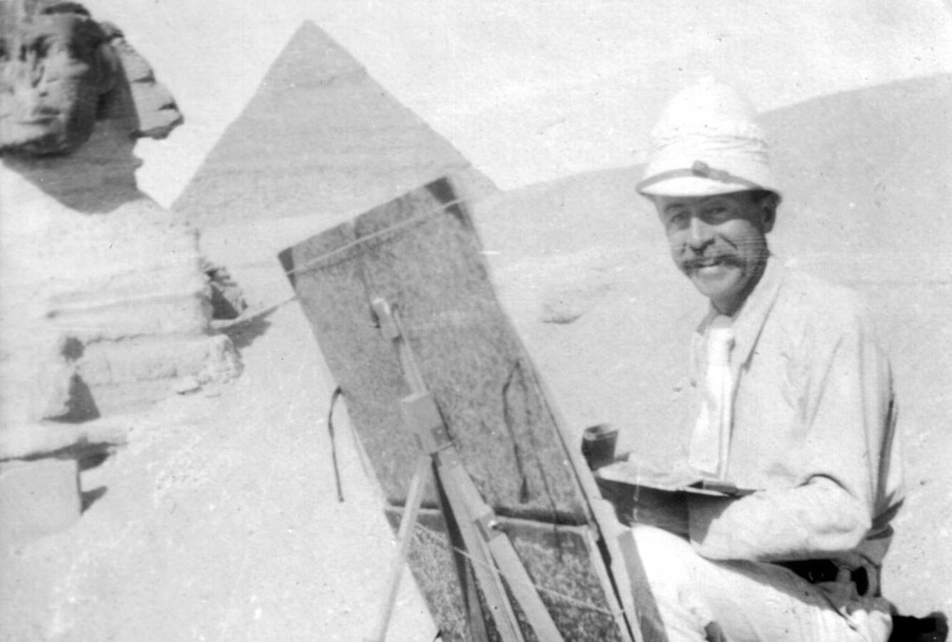 Undated photo of Joseph Lindon Smith painting near the Sphinx at Giza, looking west. Courtesy of the Dublin Historical Society.