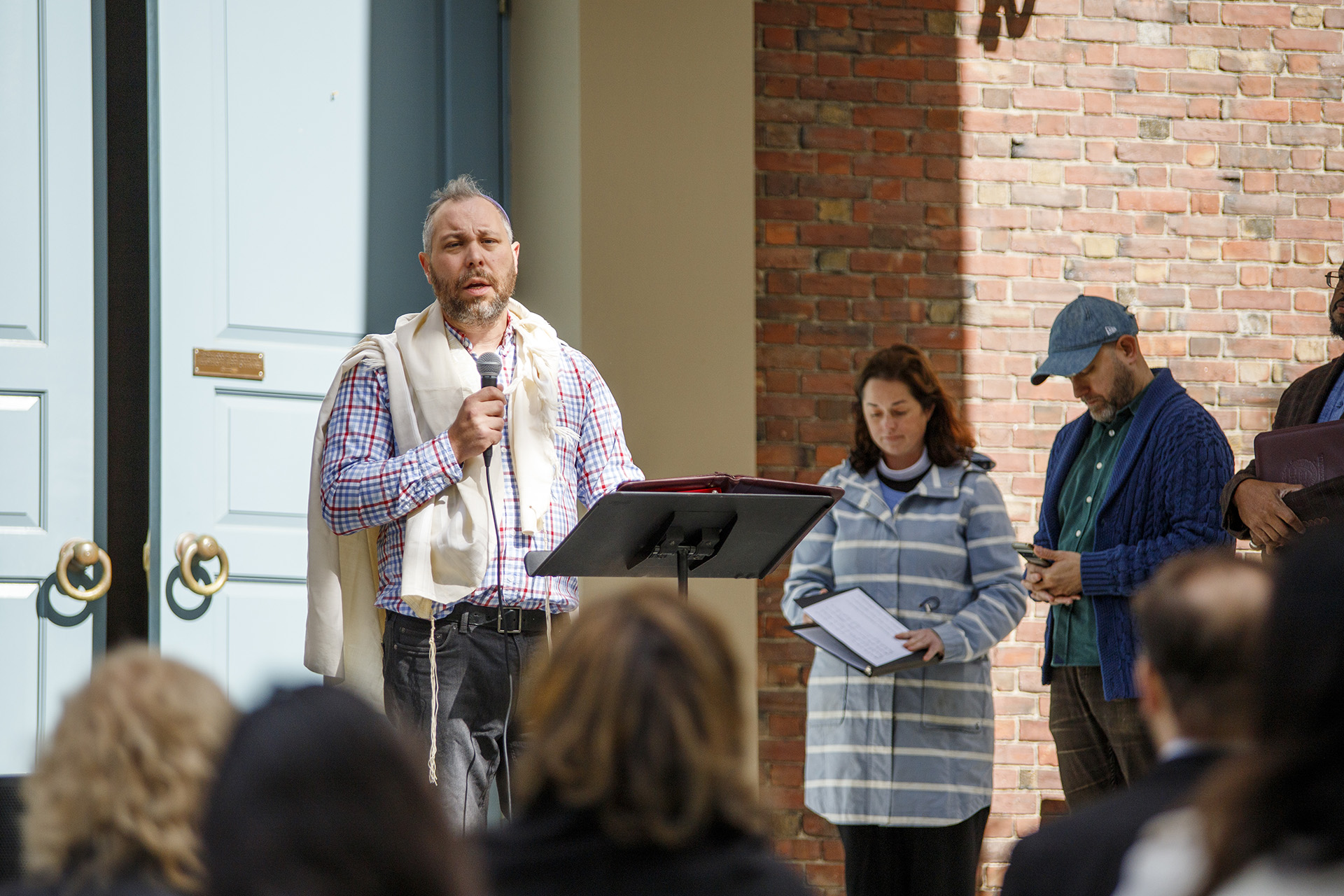 Rabbi Getzel Davis speaks at an interfaith vigil outside Harvard's Memorial Church.