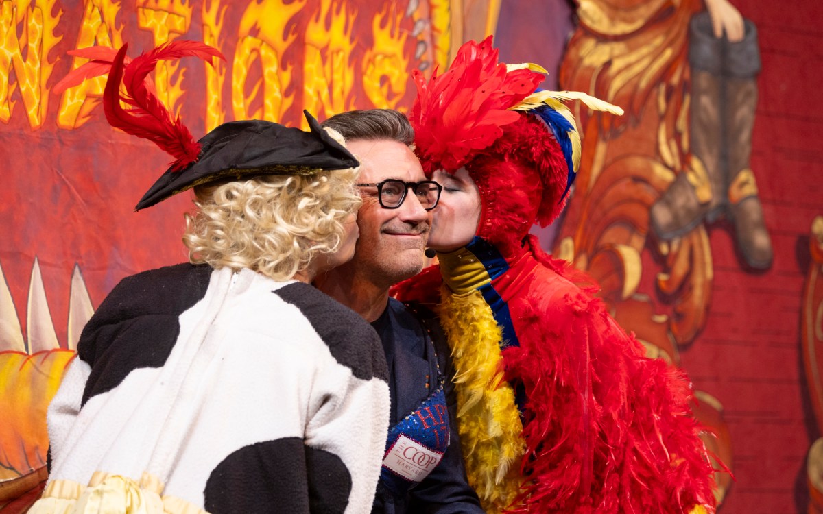 Ava Pallotta and Jessica Zisk kiss Hasty Pudding Man of the Year Jon Hamm during his roast in Farkas Hall.