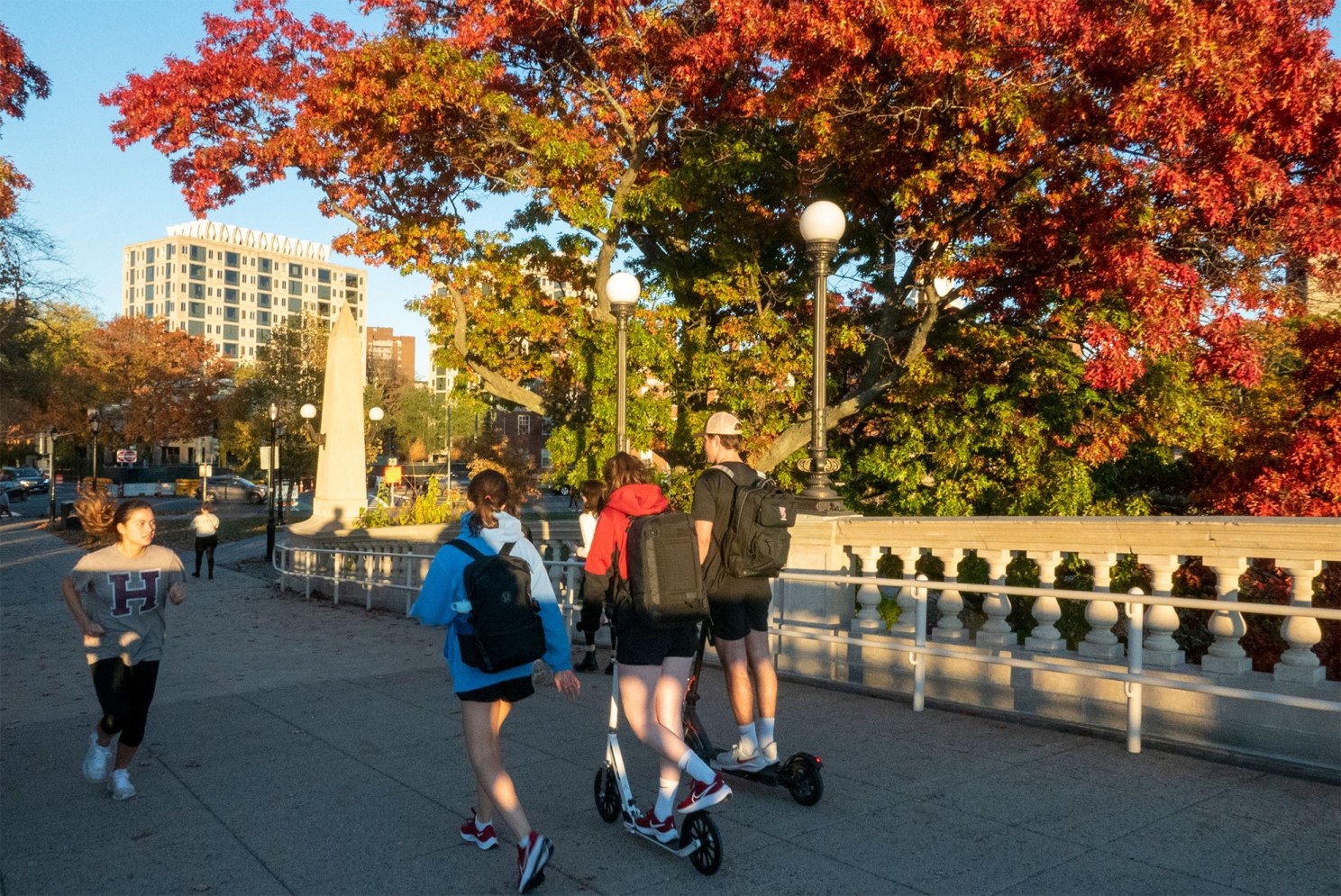 Students walk across the Weeks Bridge, which connects Harvard’s Cambridge and Allston campuses.