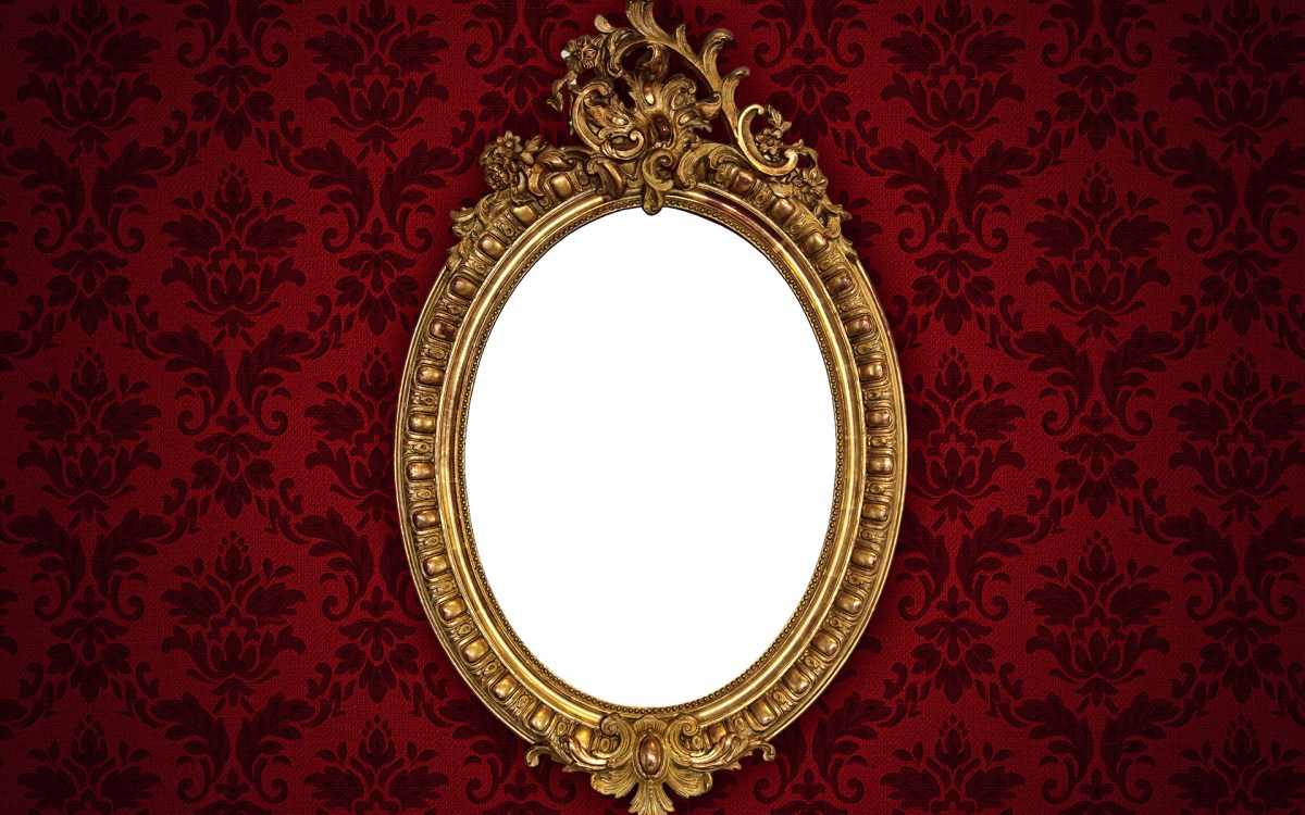 Mirror set in ornate gold frame.