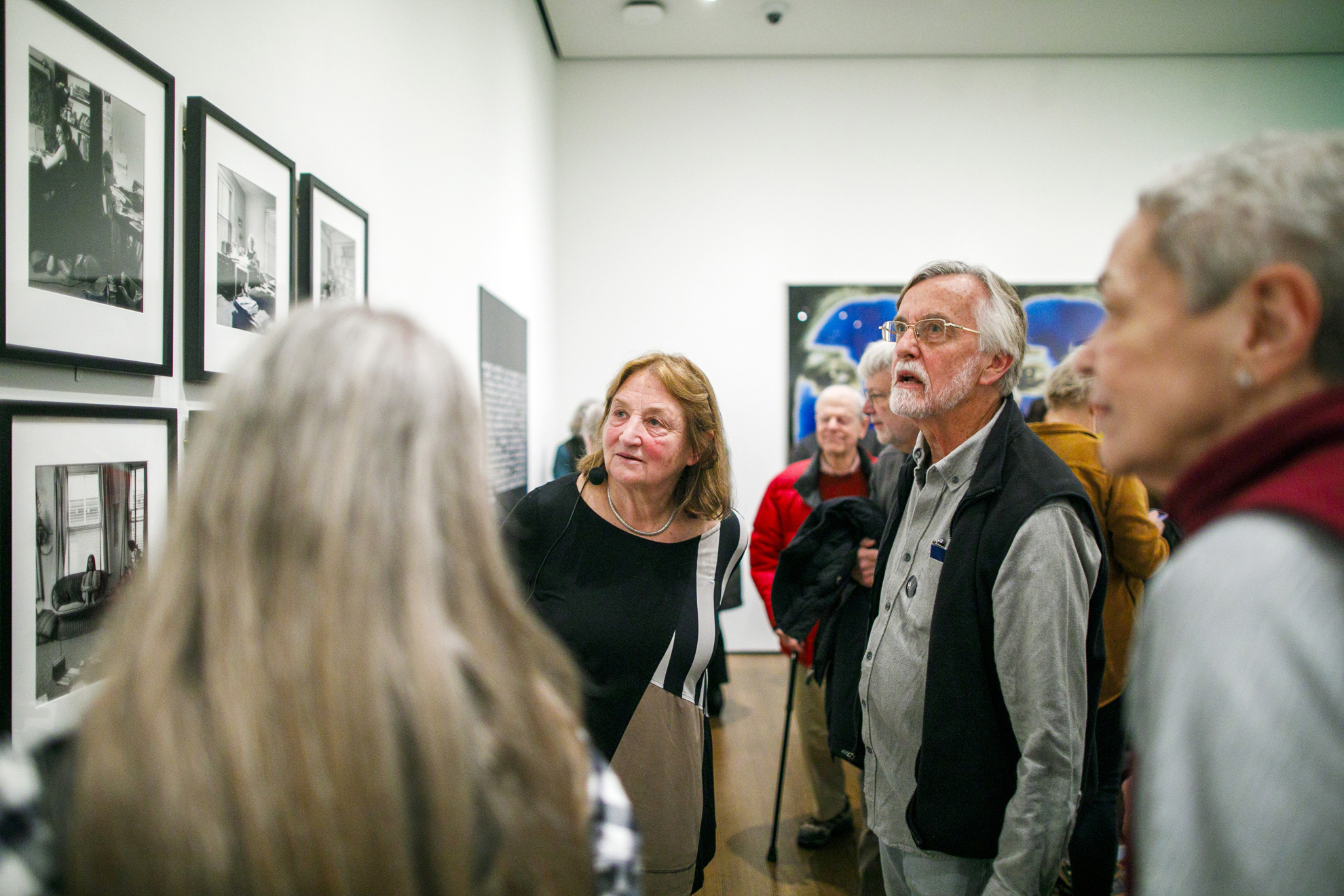 Susan Meiselas (left) speaks with attendees following the talk. 