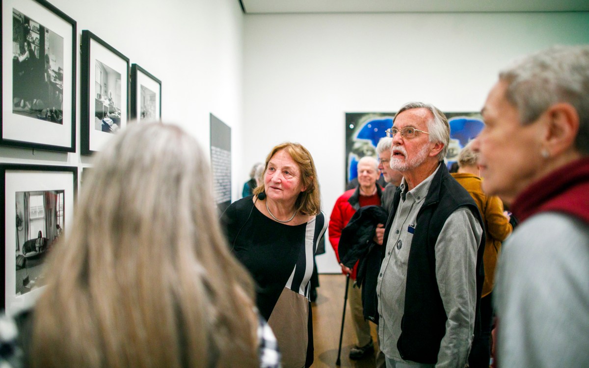 Susan Meiselas (left) speaks with attendees following the talk.