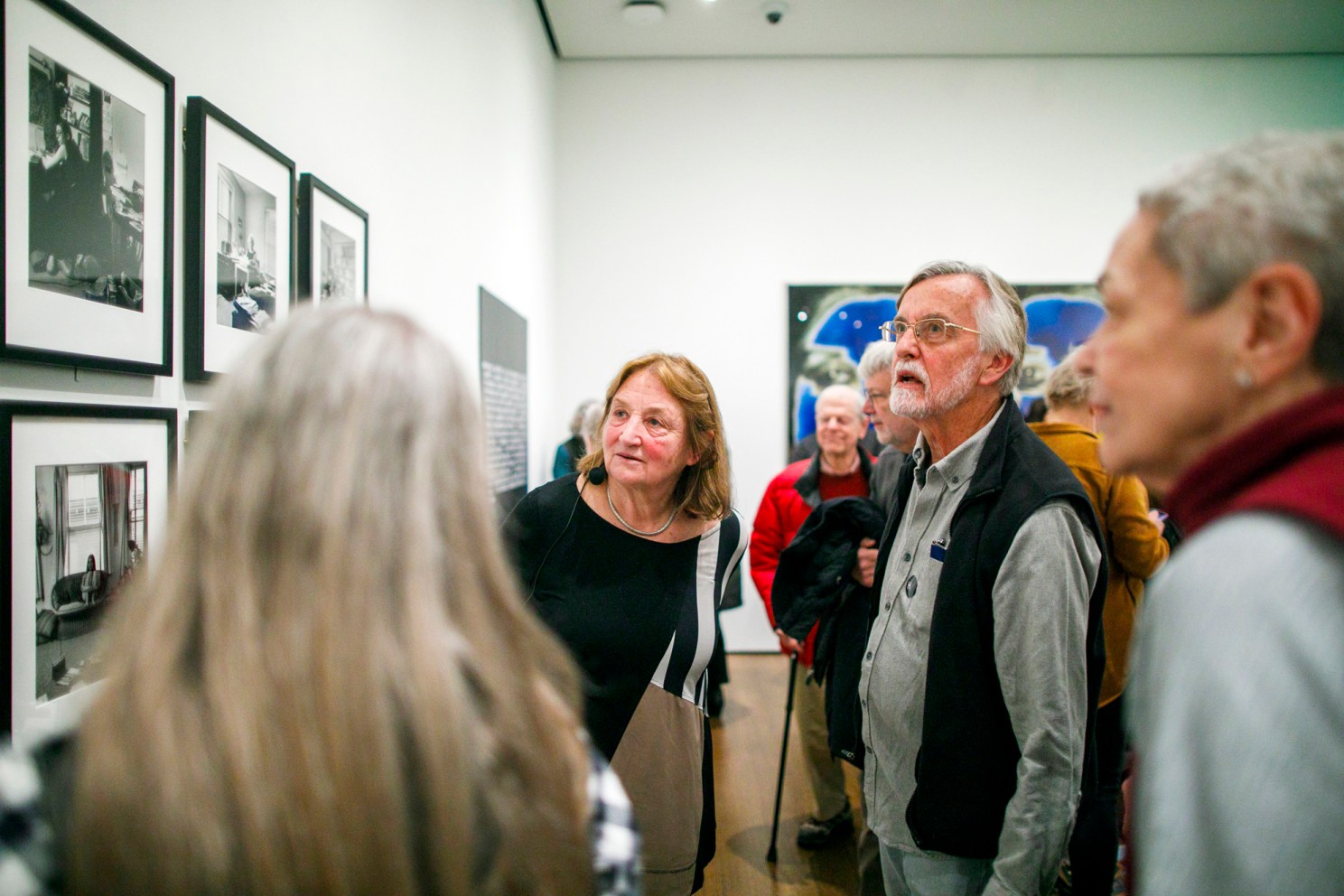 Susan Meiselas (left) speaks with attendees following the talk.