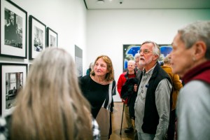 Susan Meiselas (left) speaks with attendees following the talk.