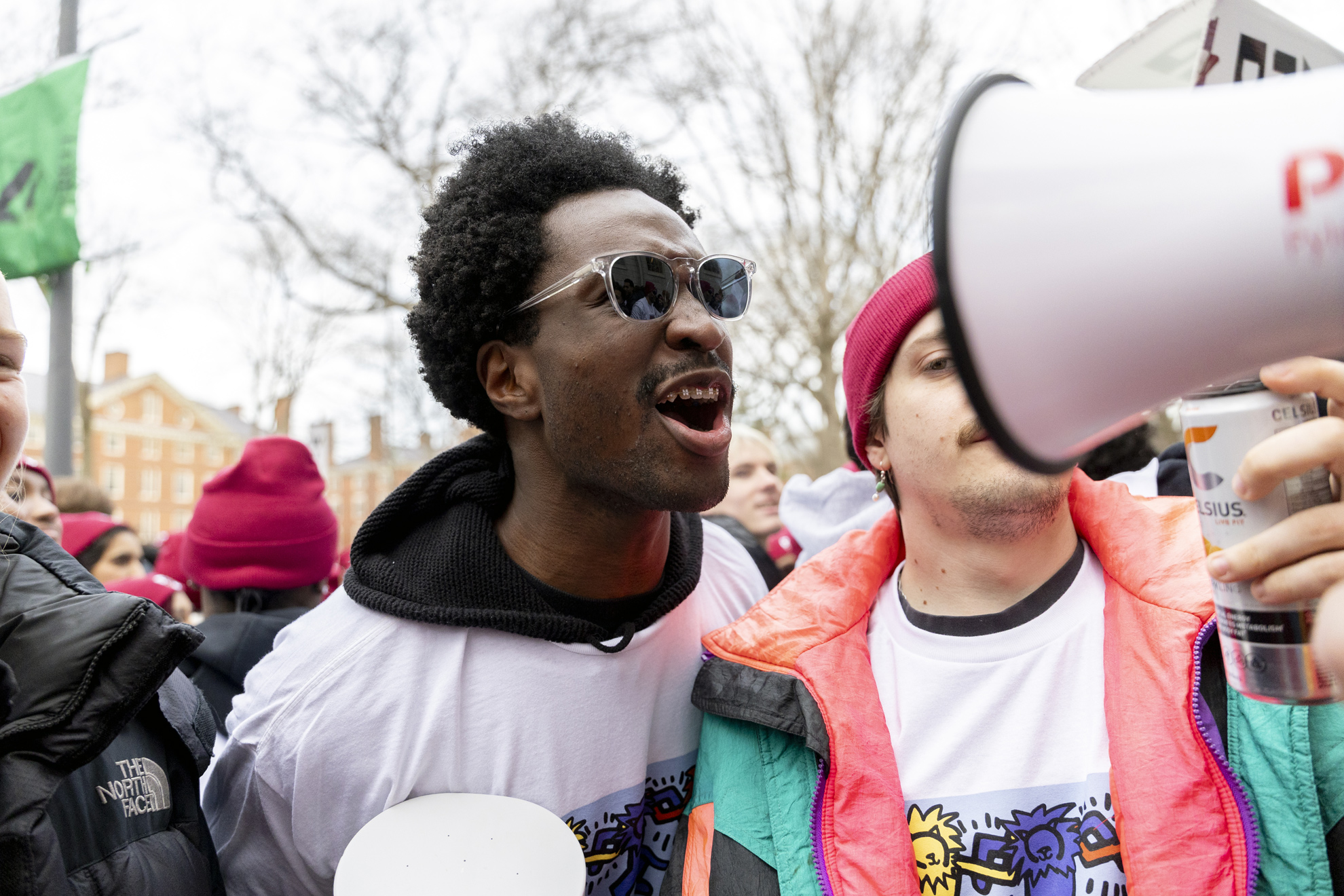 A Winthrop House resident cheers in Harvard Yard.