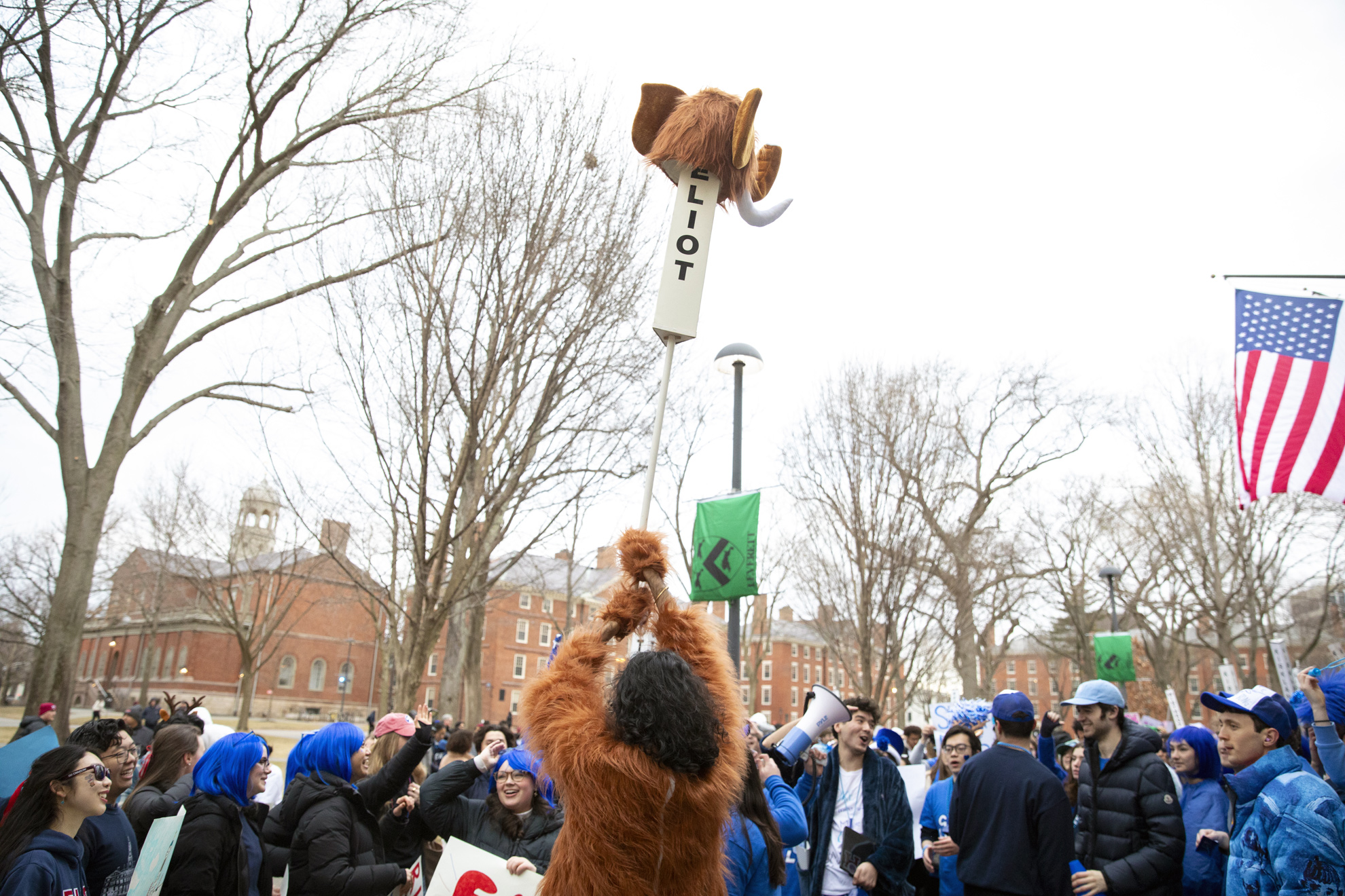 An Eliot house resident in a mastodon costume rallies in front of University Hall.