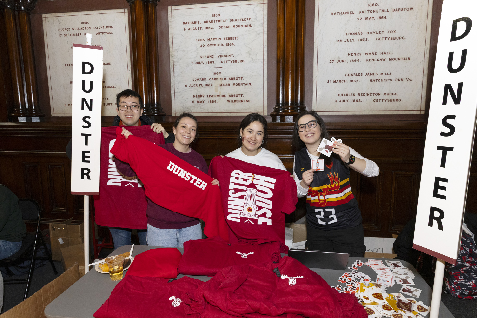 Michael Young '25 (from left), Naomi Whidden '27, Emily Schwartz '27, and Mila Ivanovska '25 pose for a photo together at the Dunster House table.