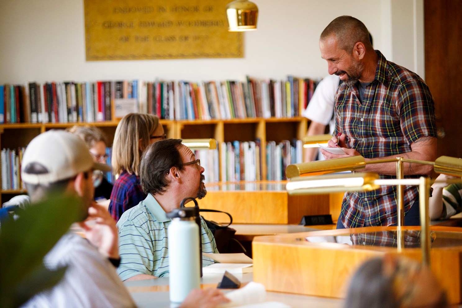 David Sherman mingles with poetry workshop participants.