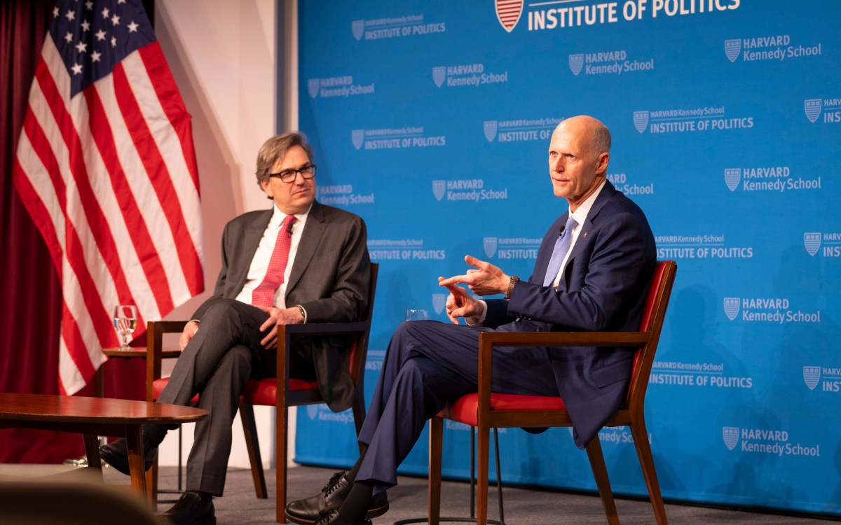 Jason Furman (left) and Rick Scott.