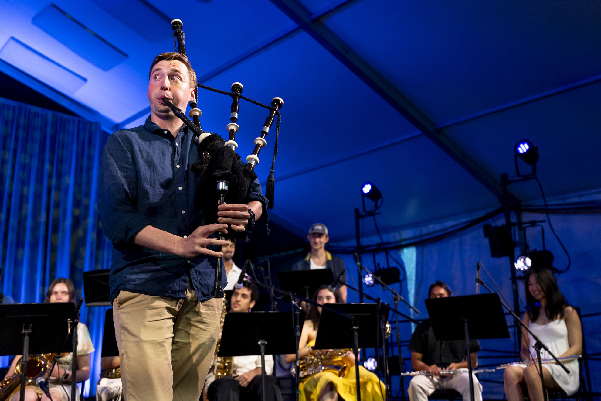 Matthew Andrews '25 plays the bagpipes during the Charles Revival and Friends performance at the Science Center Plaza tent.