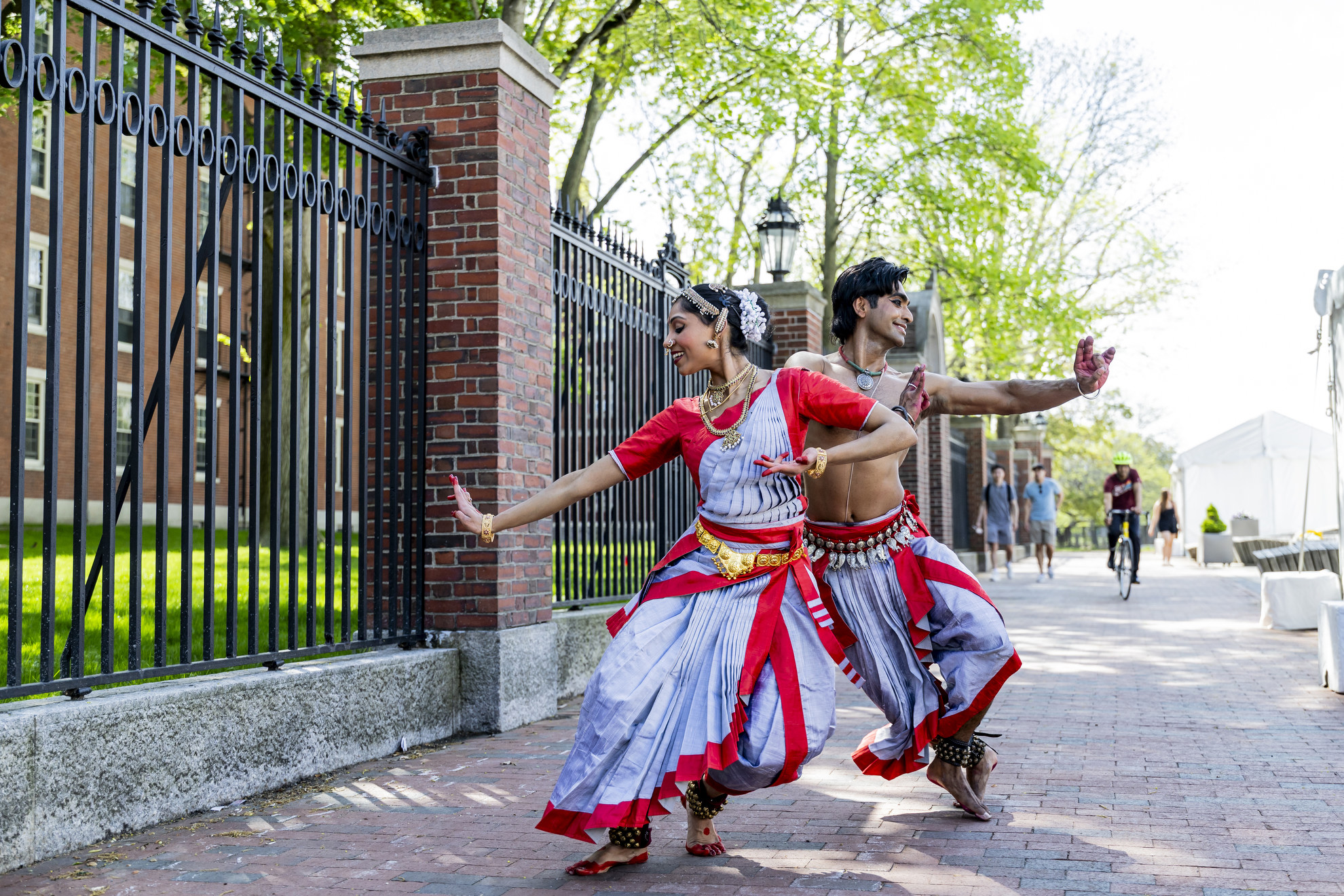 Anugraha Raman ‘12 (left) and Kohal Das warm up for their performance in the Science Center Plaza at Arts Fest 2025 at Harvard University.