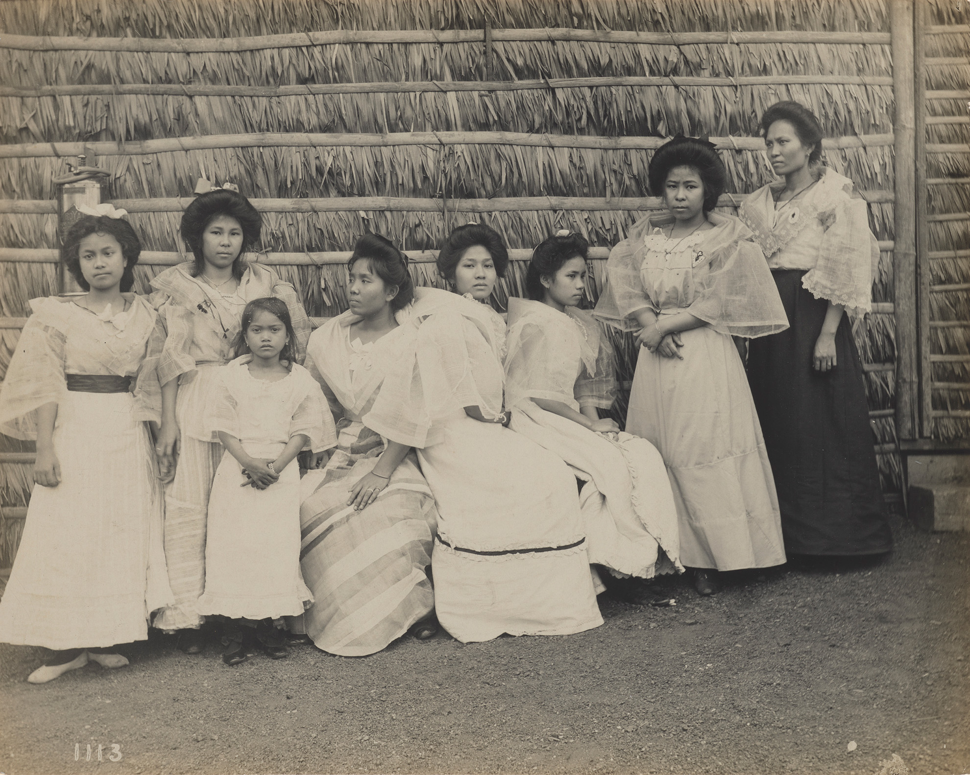 A black-and-white photograph of women and children at the 1904 St. Louis World's Fair