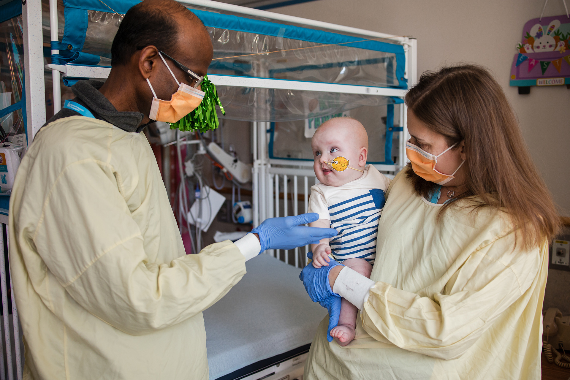 Doctors Kiran Musunuru and Rebecca Ahrens-Nicklas hold Baby KJ Muldoon.