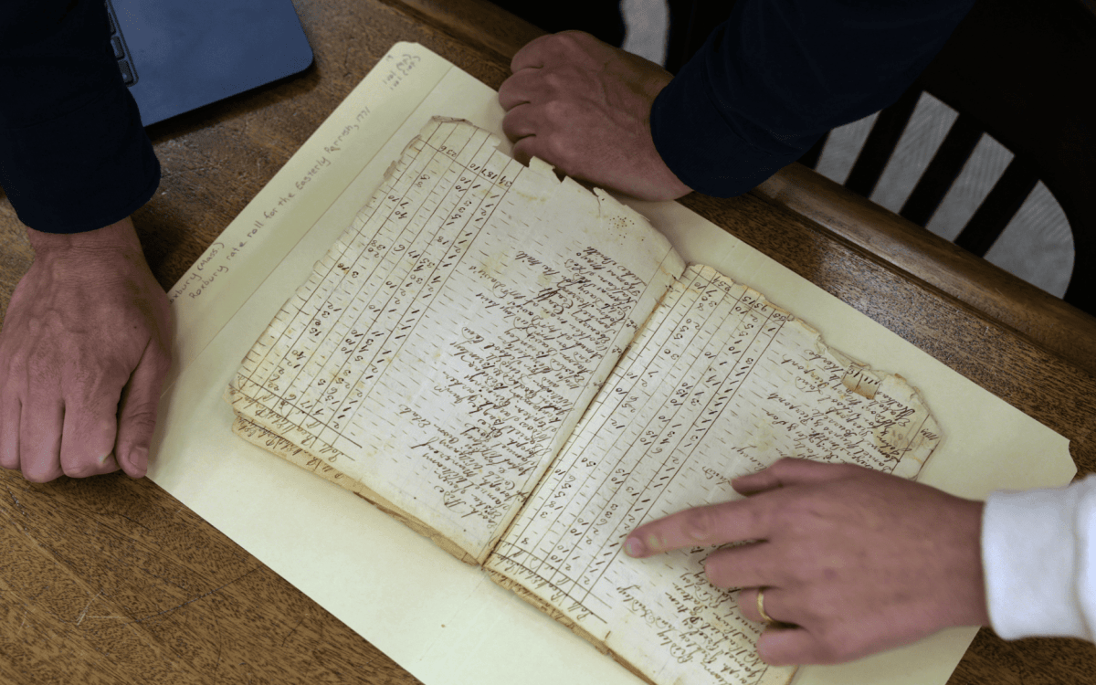 Gabriel Raeburn reviews documents with fellow American Ancestors researcher Christine Bachman-Sanders.