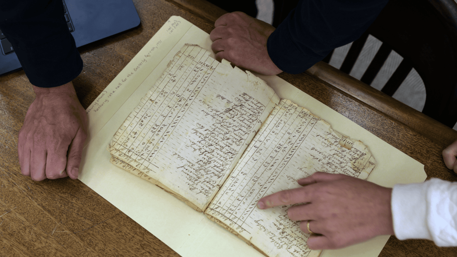 Gabriel Raeburn reviews documents with fellow American Ancestors researcher Christine Bachman-Sanders.