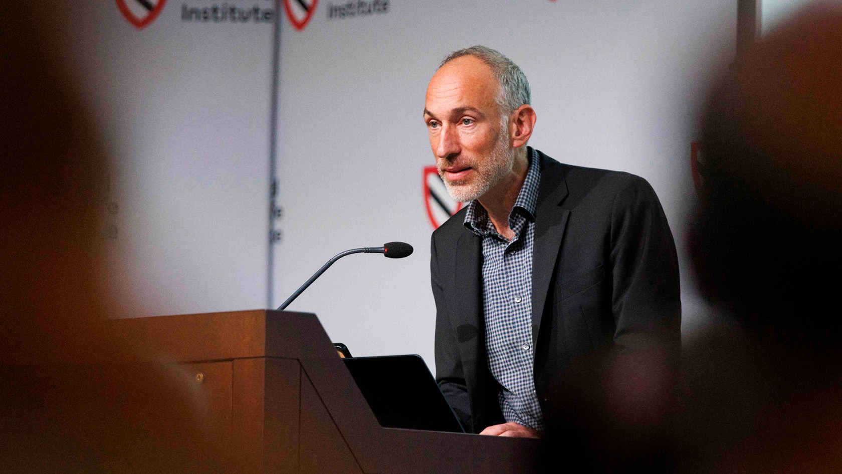 David Reich at lectern.