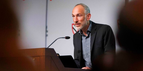 David Reich at lectern.