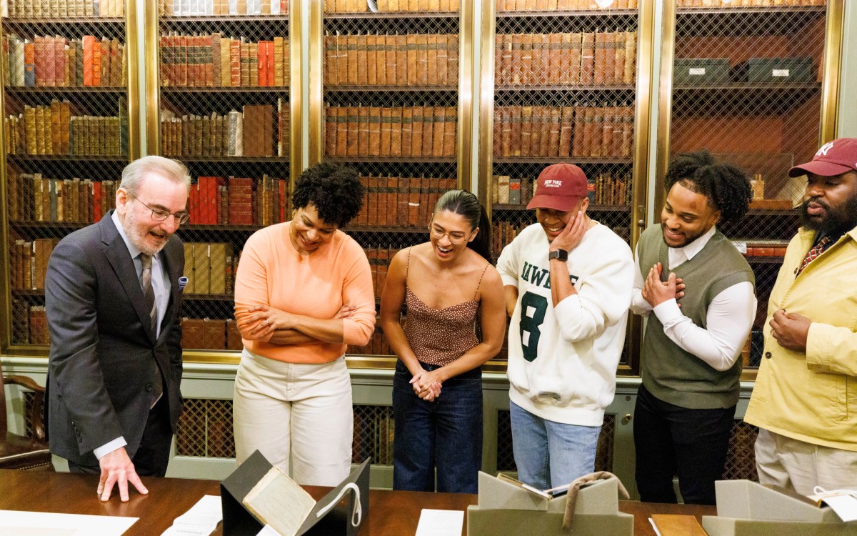 John Overholt showing documents to the cast of 'Hamilton'.
